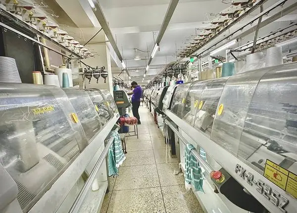 Knitting machines at a knitwear supplier in Bangladesh